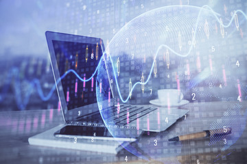 Financial market graph hologram and personal computer on background. Multi exposure. Concept of forex.