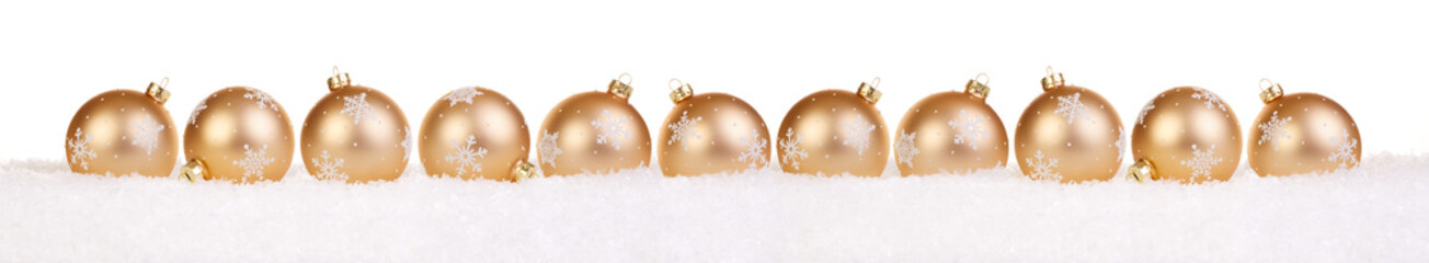 Golden christmas balls in a row isolated on snow, Christmas bauble