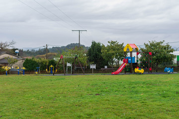 Obraz na płótnie Canvas Kids playground with swings and slides
