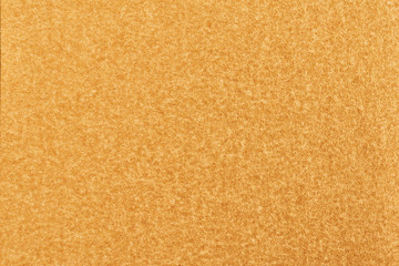 Gold paper with abstract texture for background. Paper for interior and exterior decoration or background for handcrafts. Gold paper background.