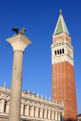 Fototapeta na wymiar Saint Mark tower and the winged Lion in Venice, Italy