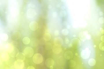 Abstract bright spring or summer landscape texture with natural green bokeh lights and yellow circular lights with sunshine and sun rays. Beautiful autumn background with copy space.