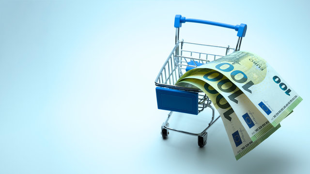 Banknotes of 100 euros in a stroller for shopping. Spend three hundred euros and get a bonus. Blue tinted background. Copy space. The concept of discounts, Template for black friday, cyber monday.