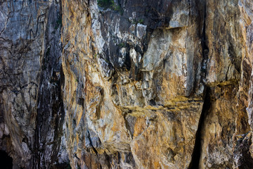 Rock texture and surface background. Cracked and weathered natural stone background.