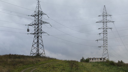 two high voltage power transmission tower