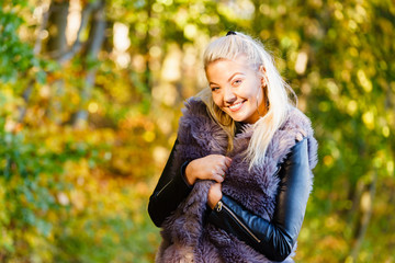 Fashion woman walking in autumn park