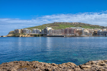 Fototapeta na wymiar View of the town and coastline of the bay Marsalforn, Gozo, Malta, Europe