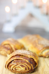 baked christmas strudel with apples on a background of lights.