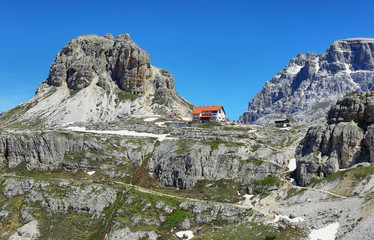 Fototapeta na wymiar Rifugio Auronzo and Dolomites mountains in National Park Tre Cime di Lavaredo,Dolomites alps, Italy