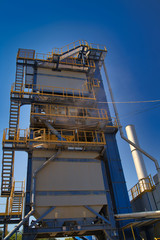 Construction site. Construction of a plant for the production of asphalt. Selective focus. Closeup.