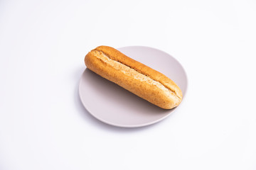 Isolated baked loaf of bread on white background.