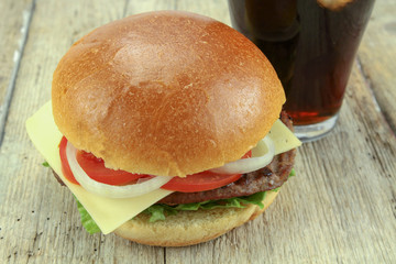  burger with beef and glass of cola