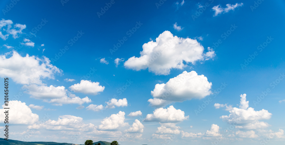 Wall mural blue sky and clouds background