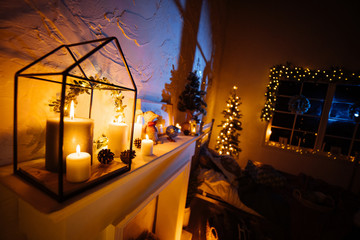 New Year 2020 interior with candles, bulbs and bokeh