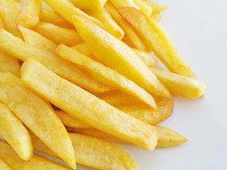 French fries or Potato fries on a white plate. 
