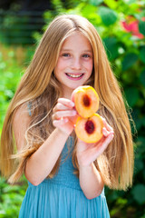 Happy little girl with a peach