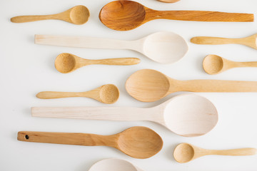 Assortment of wooden spoons.Set of new wooden kitchen utensils (spoons) isolated on white.