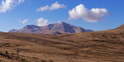 Autumn mountain landscape, Sunny day, family weekend travel. Subalpine meadows.