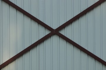 metal texture of gray iron wall and brown bars