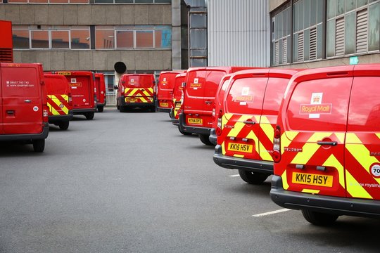 LONDON, UK - JULY 7, 2016: Royal Mail vehicles in London. Royal Mail was founded in 1516. It employs 160,000 people.