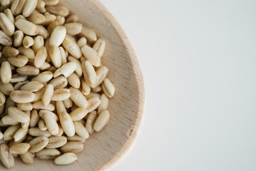 Wheat grain in wooden spoon