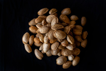Almonds on a black background