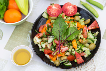 Fresh colorful vegetable salad in plate. Cooking healthy diet food	