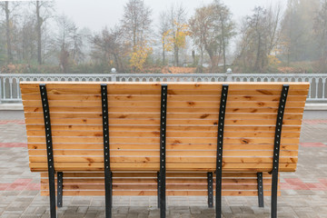 New benches on the waterfront foggy morning
