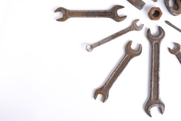 Old rusty stainless steel crescent wrench isolated on white top view