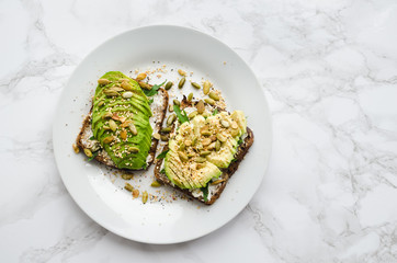Healthy avocado toasts for breakfast or lunch