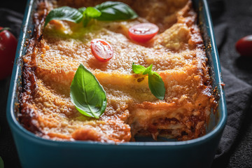 Tasty lasagna baked in casserole with cheese