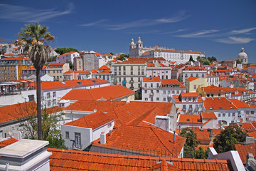 Fototapeta na wymiar Colorful panorama of Lisbon with red roves