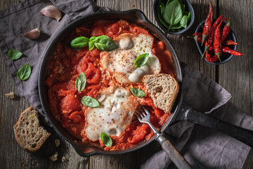 Delicious shakshuka served with fresh wholemeal bread