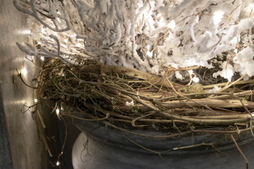 Naklejka premium Winter Eco decor in Scandinavian style with branches and lights.