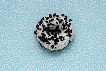 donut on blue with pattern background, top view