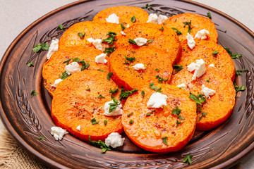 Roasted pumpkin with salted cheese and herbs