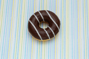 donut on colored lines background, top view