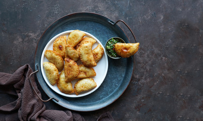 Empanadas de carne argentinas con  chimichurri salsa