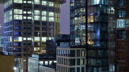 Fototapeta na wymiar The building under construction illuminated at night