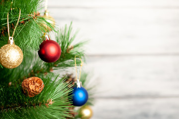 Christmas card with decorated Christmas toys on the tree with a place for your congratulations