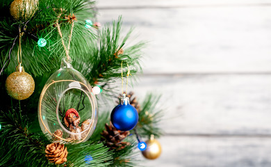 Christmas card with decorated Christmas toys on the tree with a place for your congratulations