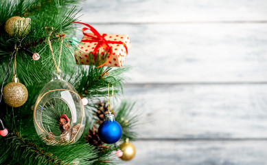 Christmas card with decorated Christmas toys on the tree with a place for your congratulations