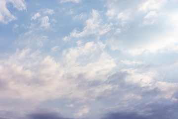 landscape sky with blue clouds and sunbeams at sunset. Background texture