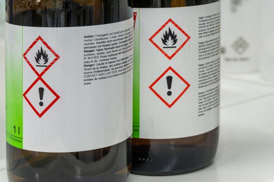 bottles of chemicals - flammable fluid - attention sign