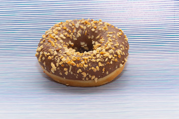 donut on purple with lines background, close up view