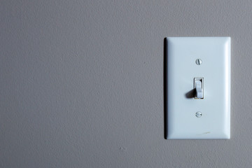 White switch on grey wall 0001
