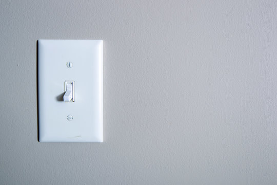 White switch on grey wall 4583
