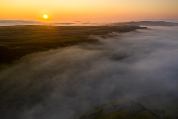 Fototapeta na wymiar Drone shot of msty sunrise above Malham, North Yorkshire