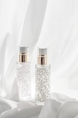 Skincare serum and make-up primer gel bottle, moisturizing lotion and lifting cream emulsion,...