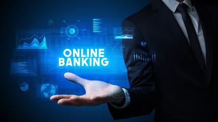 Hand of Businessman holding ONLINE BANKING inscription, business success concept